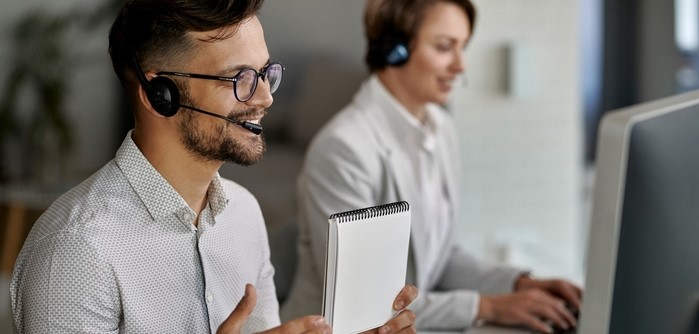 Male employee talking to a prospect on phone.