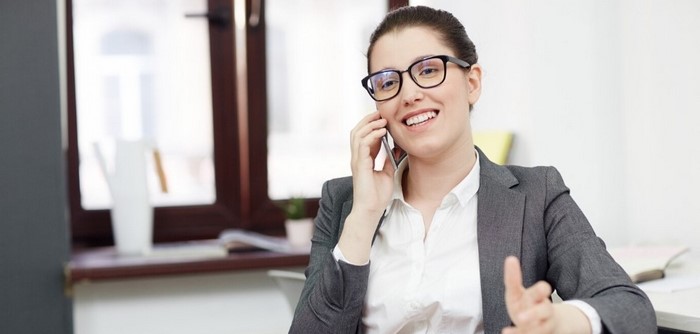 Smiling woman with phone.