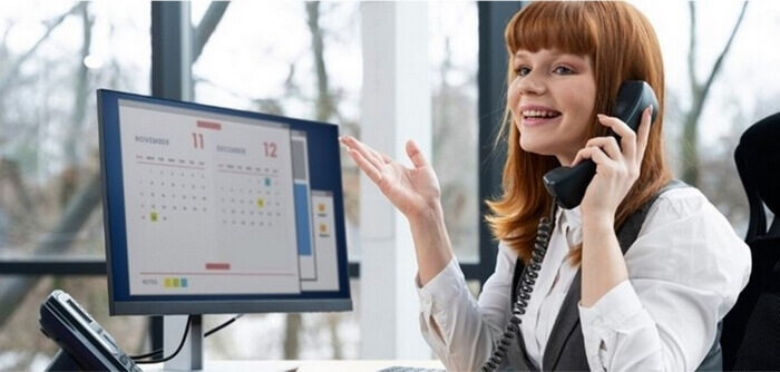Woman talking to a client on a phone.